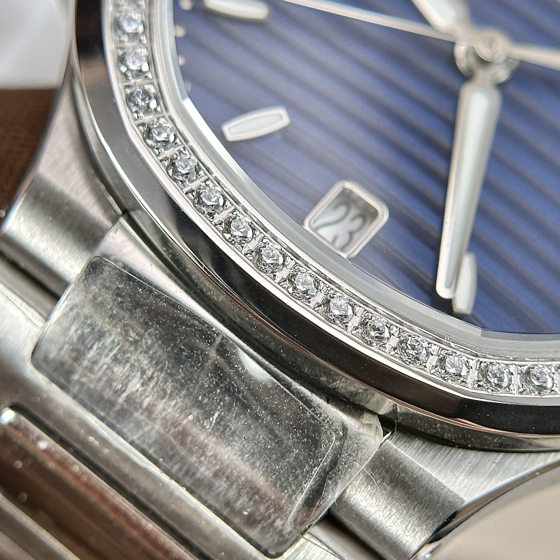 Patek Philippe Nautilus 7118 Super Clone Watch Blue Dial Stone Bezel 35.2mm - Image 4