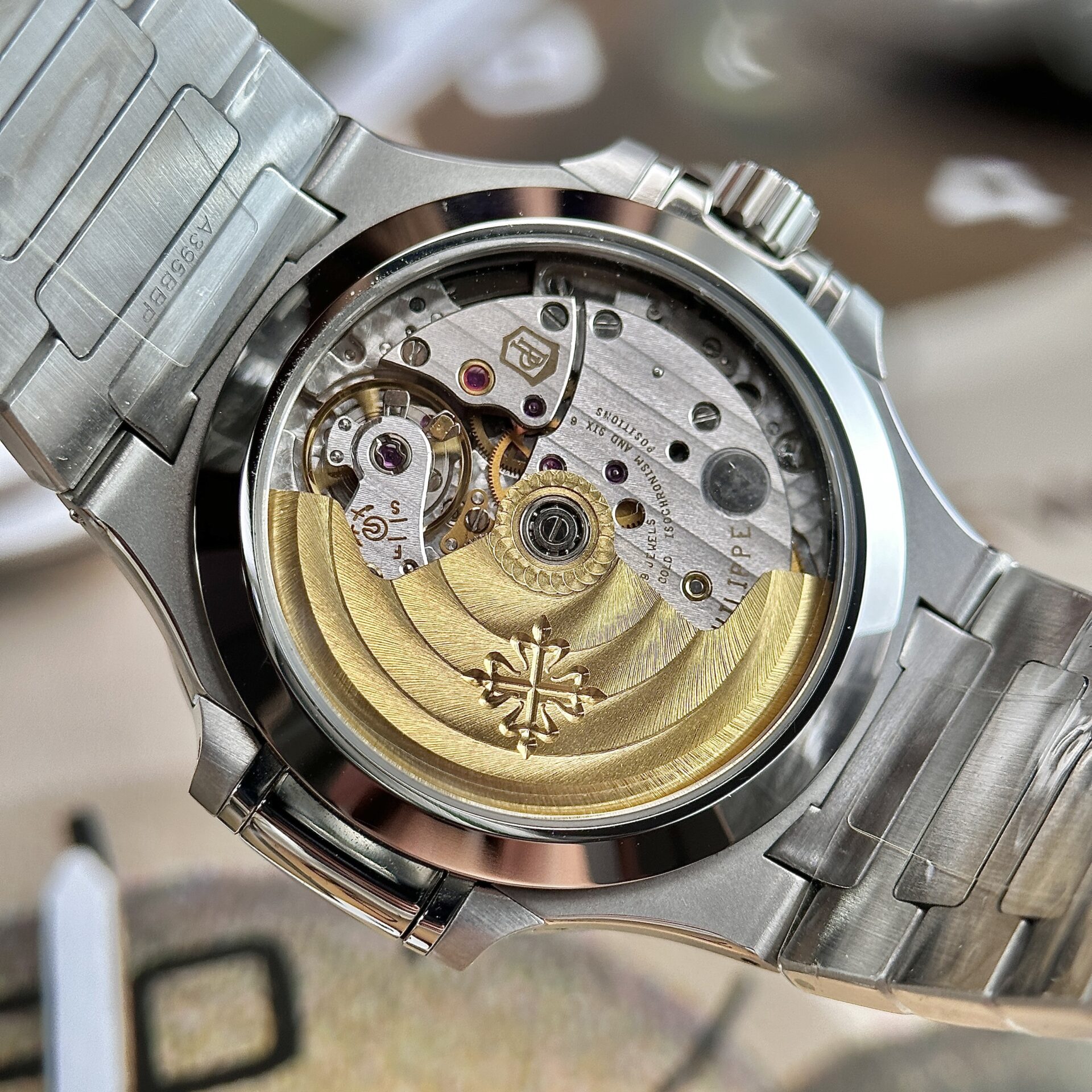 Patek Philippe Nautilus 7118 Super Clone Watch Blue Dial Stone Bezel 35.2mm - Image 9